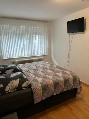 Ein Bett oder Betten in einem Zimmer der Unterkunft Holiday-Ferienwohnung Solingen-Mitte