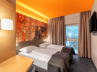 Ein Bett oder Betten in einem Zimmer der Unterkunft B&B HOTEL Hagen