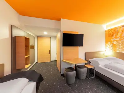 Ein Bett oder Betten in einem Zimmer der Unterkunft B&B HOTEL Hagen