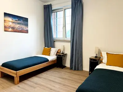 Ein Bett oder Betten in einem Zimmer der Unterkunft Aparthotel 9 min to Dus Airport & 17 min to DUS Messe