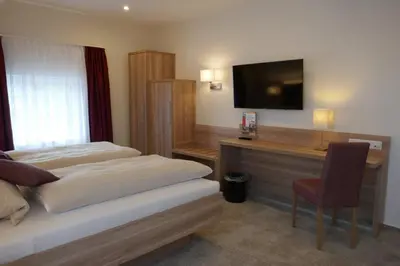 Ein Bett oder Betten in einem Zimmer der Unterkunft Hotel van Lendt garni