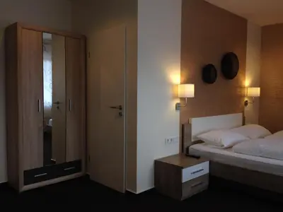 Ein Bett oder Betten in einem Zimmer der Unterkunft Hotel van Lendt garni