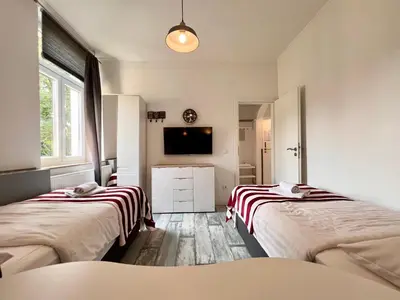 Ein Bett oder Betten in einem Zimmer der Unterkunft London Suite für 4 mit Küche und WIFI