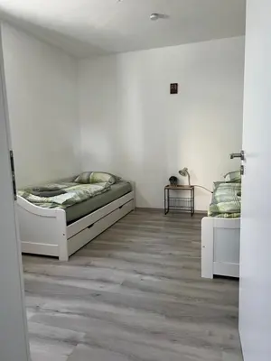 Ein Bett oder Betten in einem Zimmer der Unterkunft Waldnest