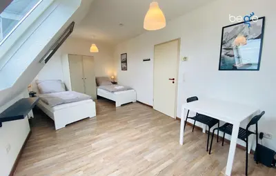 Ein Bett oder Betten in einem Zimmer der Unterkunft SASI HOMES Business Lodge