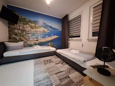 Ein Bett oder Betten in einem Zimmer der Unterkunft Tam Wohnung