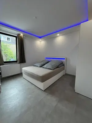 Ein Bett oder Betten in einem Zimmer der Unterkunft Schöne Mitte von Oberhausen