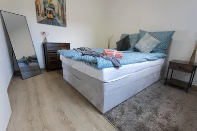 Ein Bett oder Betten in einem Zimmer der Unterkunft Idyllische Stadtwohnung