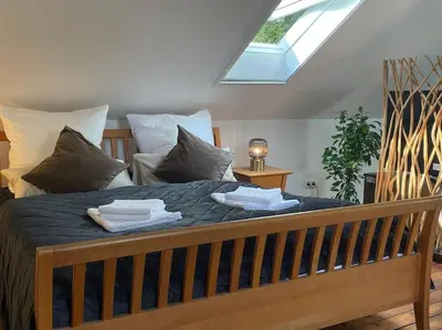 Ein Bett oder Betten in einem Zimmer der Unterkunft Das grüne Haus allein für Dich!