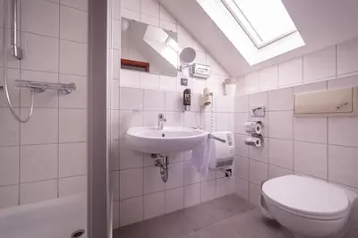Ein Badezimmer in der Unterkunft Hotel Omega
