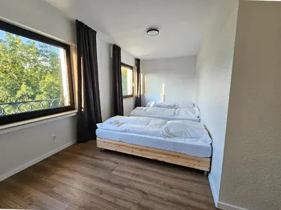 Ein Bett oder Betten in einem Zimmer der Unterkunft T&K Apartments - Solingen - 3-6 Zimmer Grand Apartments with private parking for all vehicles