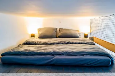 Ein Bett oder Betten in einem Zimmer der Unterkunft #112 Moderne Altstadt Wohnung im Herzen von Remscheid-Lennep