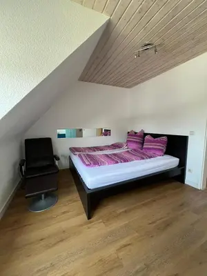 Ein Bett oder Betten in einem Zimmer der Unterkunft Gemütliche Ferienwohnung