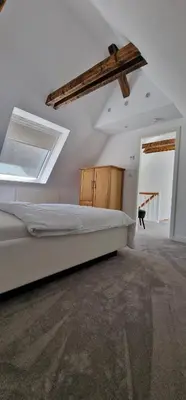 Ein Bett oder Betten in einem Zimmer der Unterkunft Ruhiges Haus mit Whirlpool für 5 Gäste nahe Messe Essen mit 3 Schlafzimmern