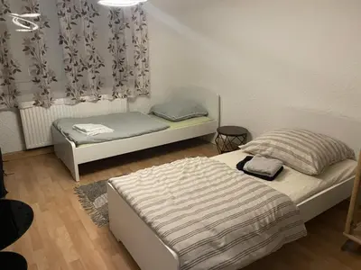 Ein Bett oder Betten in einem Zimmer der Unterkunft MAD Ferienwohnungen 1