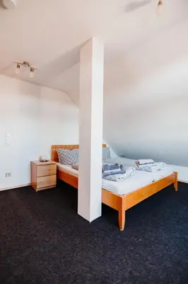 Ein Bett oder Betten in einem Zimmer der Unterkunft Ferienwohnung Oberhausen Sterkrade Maisonette nahe CentrO