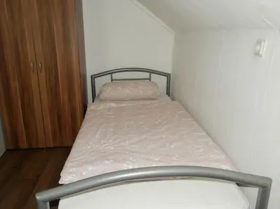Ein Bett oder Betten in einem Zimmer der Unterkunft Ferienwohnung Heiligenhaus-powered by Çelik