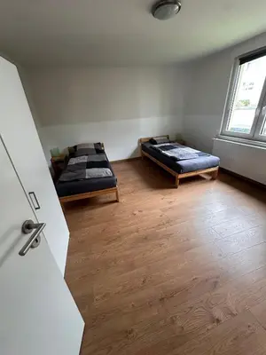 Ein Bett oder Betten in einem Zimmer der Unterkunft Ferien- Monteurapartments nähe Veltins Arena