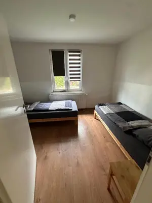 Ein Bett oder Betten in einem Zimmer der Unterkunft Ferien- Monteurapartments nähe Veltins Arena