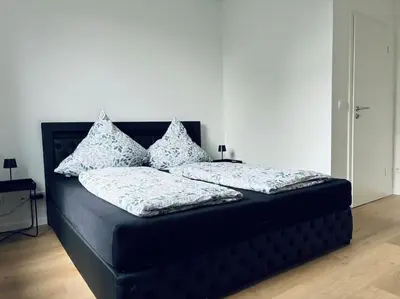 Ein Bett oder Betten in einem Zimmer der Unterkunft Große 80qm Wohnung mit mehreren Zimmern