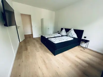 Ein Bett oder Betten in einem Zimmer der Unterkunft Große 80qm Wohnung mit mehreren Zimmern