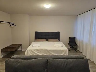 Ein Bett oder Betten in einem Zimmer der Unterkunft Modern townhouse in Wuppertal