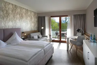 Ein Bett oder Betten in einem Zimmer der Unterkunft Jammertal Resort