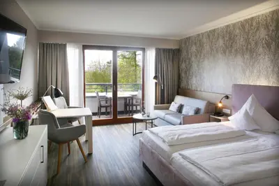 Ein Bett oder Betten in einem Zimmer der Unterkunft Jammertal Resort