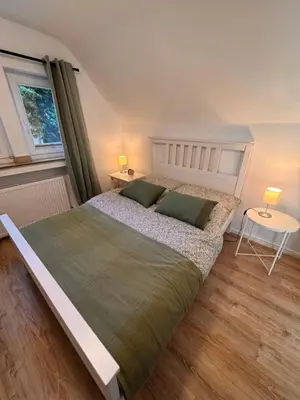 Ein Bett oder Betten in einem Zimmer der Unterkunft Ruhrtraum Kettwig Ferienwohnung am Fluss