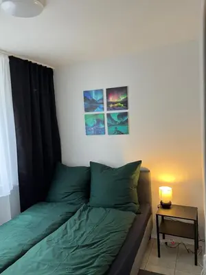 Ein Bett oder Betten in einem Zimmer der Unterkunft Ferienwohnung Drei Rosen