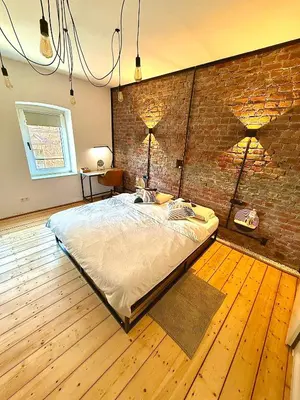 Ein Bett oder Betten in einem Zimmer der Unterkunft Suburban Loft