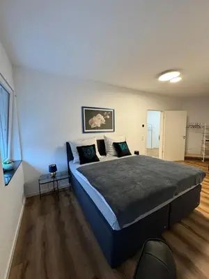 Ein Bett oder Betten in einem Zimmer der Unterkunft Zeitperlewohnen Petrol