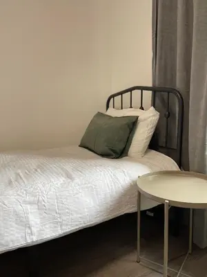 Ein Bett oder Betten in einem Zimmer der Unterkunft Home Apartments