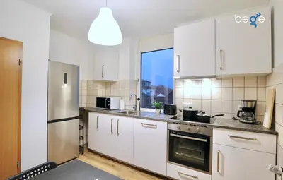 Küche/Küchenzeile in der Unterkunft BEGE APARTMENTS Corporate Corner