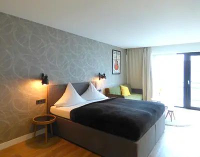 Ein Bett oder Betten in einem Zimmer der Unterkunft Niteroom Boutiquehotel & Apartements