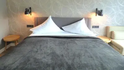 Ein Bett oder Betten in einem Zimmer der Unterkunft Niteroom Boutiquehotel & Apartements