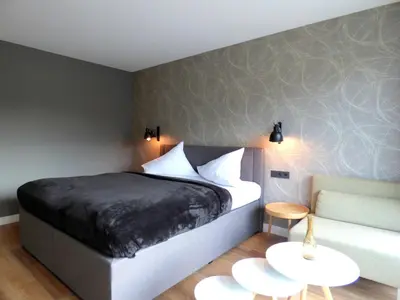 Ein Bett oder Betten in einem Zimmer der Unterkunft Niteroom Boutiquehotel & Apartements