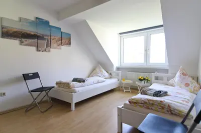 Ein Bett oder Betten in einem Zimmer der Unterkunft Top Apartmentwohnungen Veltins Arena