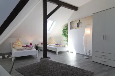 Ein Bett oder Betten in einem Zimmer der Unterkunft Top Apartmentwohnungen Veltins Arena