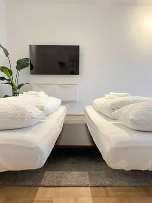 Ein Bett oder Betten in einem Zimmer der Unterkunft Moderne City-Wohnung mit Self Check-In und Free Wifi im Zentrum