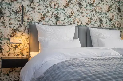 Ein Bett oder Betten in einem Zimmer der Unterkunft Marisol Design Apartment mit eigenem Stellplatz