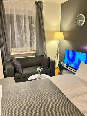 Ein Bett oder Betten in einem Zimmer der Unterkunft MN City Apartment inkl WiFi