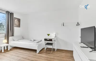 Ein Bett oder Betten in einem Zimmer der Unterkunft BEGE APARTMENTS Work Comfort