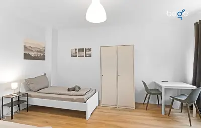 Ein Bett oder Betten in einem Zimmer der Unterkunft BEGE APARTMENTS Business Oasis