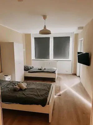 Ein Bett oder Betten in einem Zimmer der Unterkunft Wohnen im Ländereck Essen Mülheim Oberhausen BS1HL