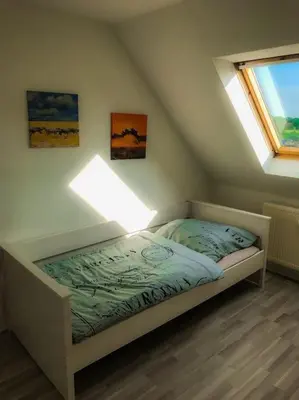 Ein Bett oder Betten in einem Zimmer der Unterkunft Über den Dächern Gelsenkirchens - Nähe Arena