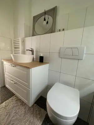 Ein Badezimmer in der Unterkunft Moderne Ferienwohnung voll möbliert und zentral