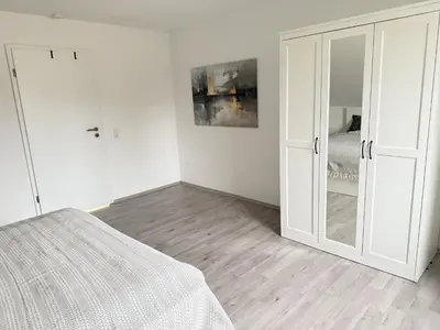 Ein Bett oder Betten in einem Zimmer der Unterkunft Helle und Charmante Dachgeschosswohnung in Top-Lage