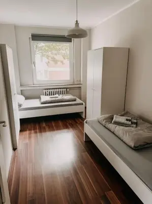 Ein Bett oder Betten in einem Zimmer der Unterkunft Ruhig wohnen zwischen Essen und Mülheim! BÖ1
