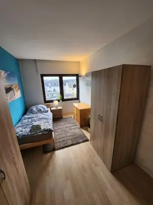 Ein Bett oder Betten in einem Zimmer der Unterkunft Monteurwohnung in Marl - Lipper 27 - DG